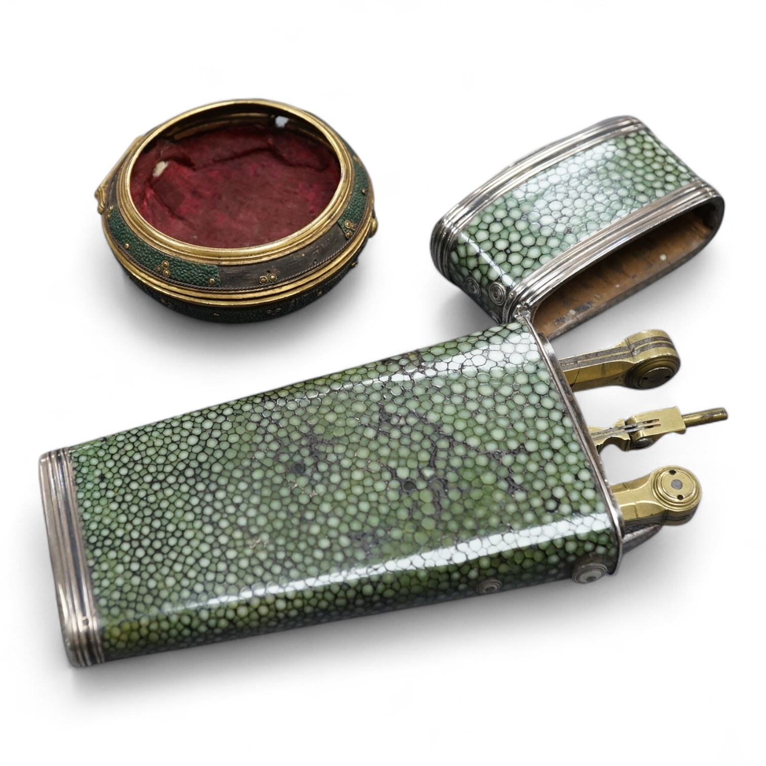 An early 19th century shagreen cased draughtsman’s set, containing three of the original instruments, together with an outside brass pair case for an early to mid 18th century pocket watch
